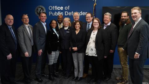 a group of county leaders appear at the opening of the public defender office