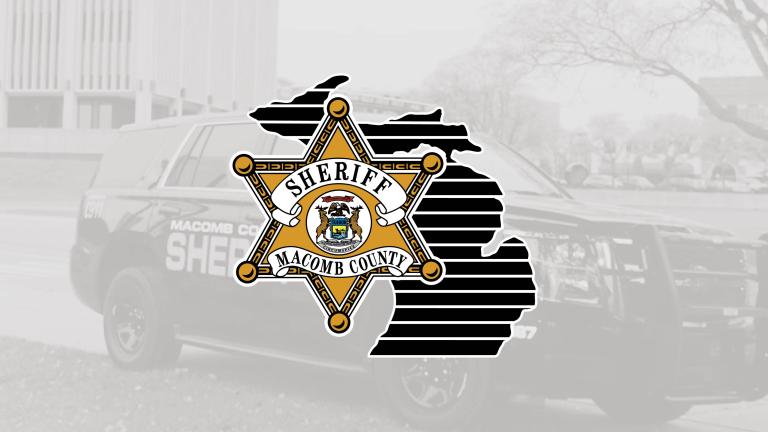 macomb county sheriff logo over a sheriff vehicle