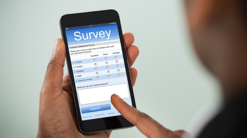 person using mobile phone to complete survey
