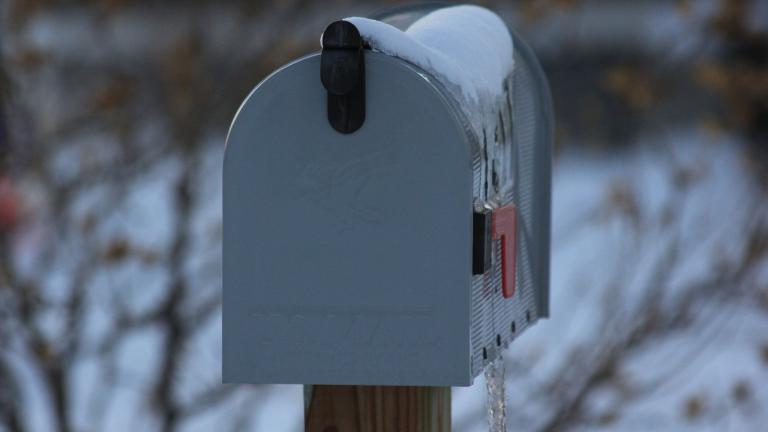 Frozen mailbox in the snow.