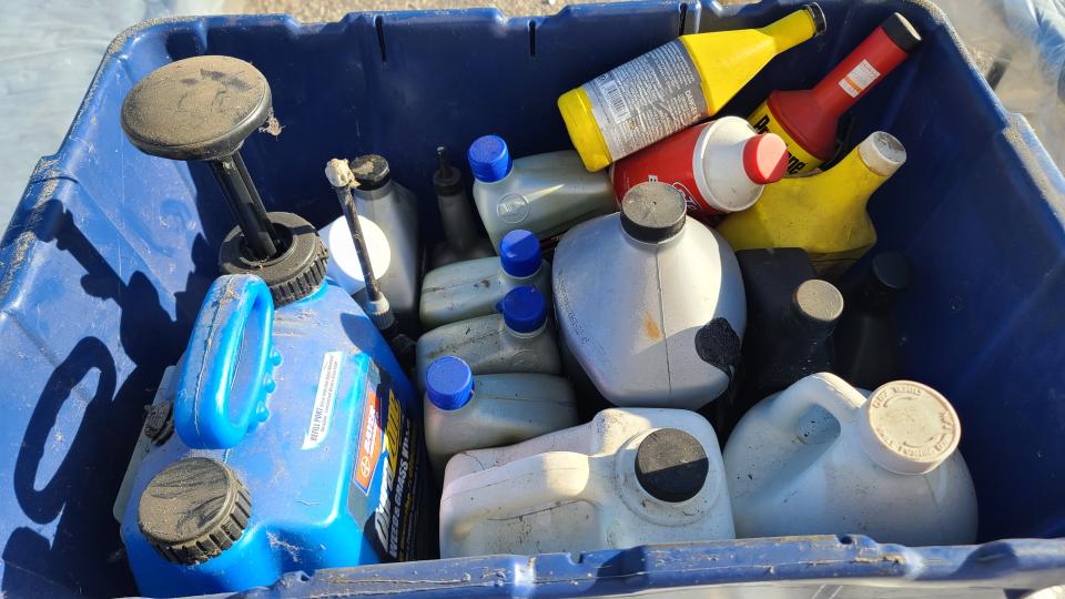 Household hazardous waste packed neatly in a plastic container.
