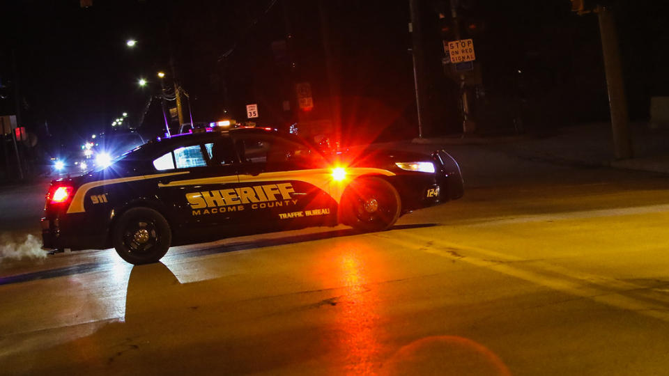 sheriff vehicle at night with lights on