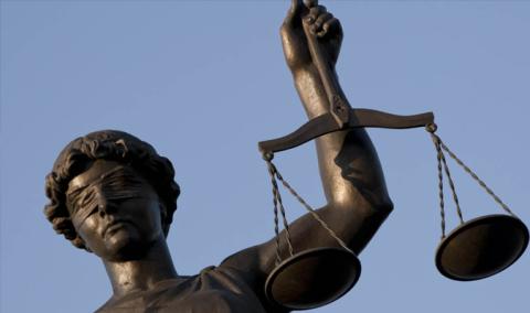 Lady Justice Statue with balancing scale Image