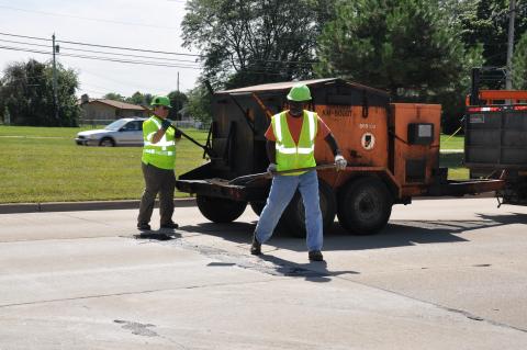 Department of Roads maintenance crew performing patch repair work.